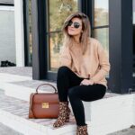 Looks casuales con suéter y jeans negros
